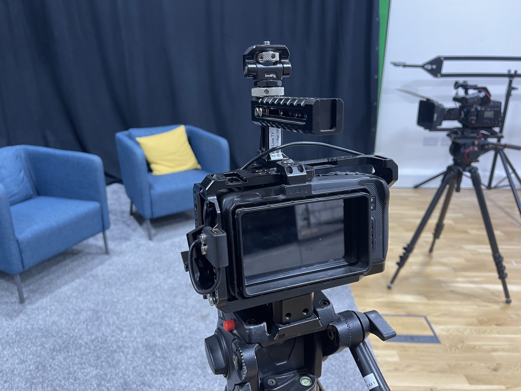 Two-camera setup framed on the interview chairs in Studio One