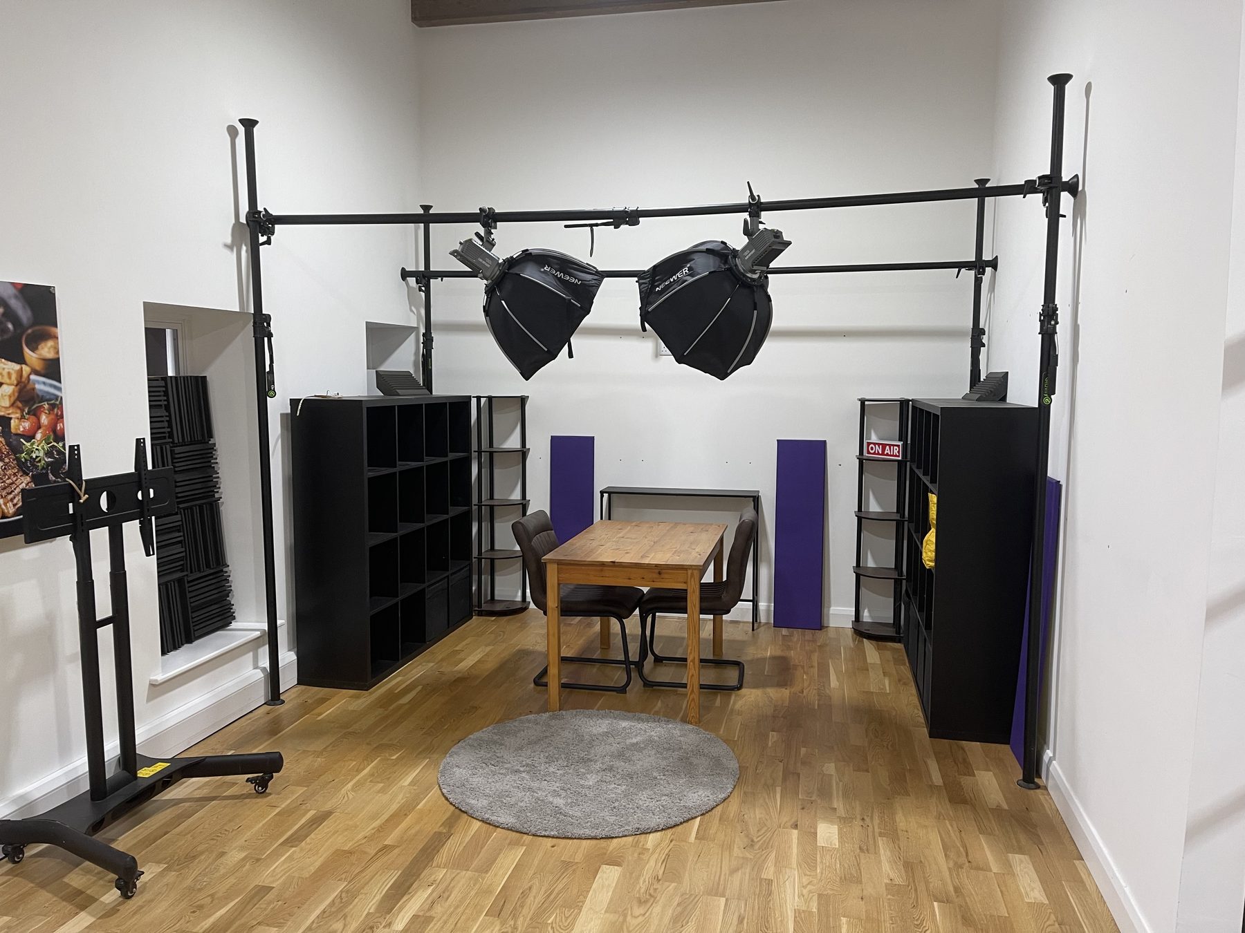 Overhead softbox lighting rig above the podcast set in Studio Two